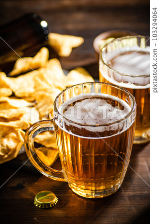 Fresh beer with corn chips. 103294064