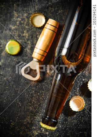 Beer in glasses and bottle opener. Beer in glasses and bottle opener. 103294141