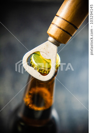 Beer bottle and opener. Beer bottle and opener. 103294145