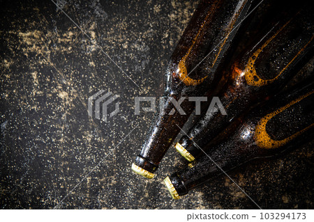 Fresh beer in closed bottles. 103294173