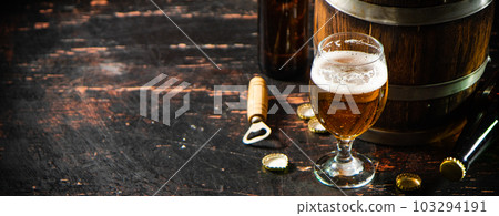 Glass with fresh beer. 103294191