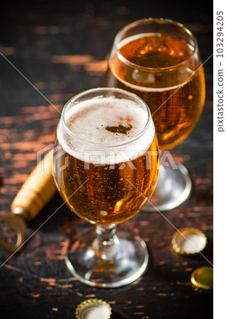 Glasses with fresh beer. 103294205