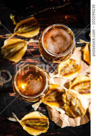 Beer and dried fish. 103294236