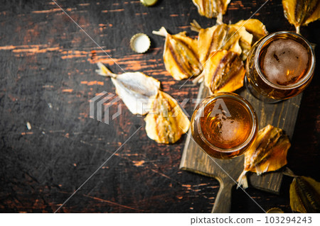 Beer and dried fish. 103294243