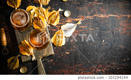 Beer and dried fish. 103294244