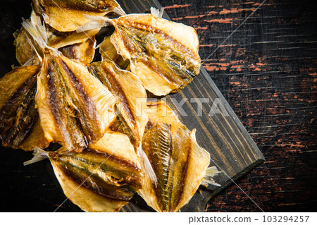 Dried and salted fish, beer snack. 103294257