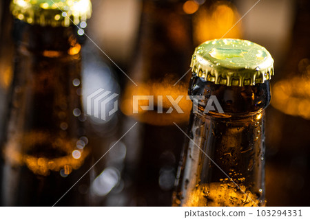 Fresh beer in closed bottles. Fresh beer in closed bottles. 103294331