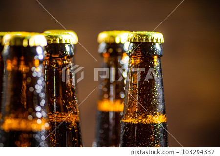 Fresh beer in closed bottles. Fresh beer in closed bottles. 103294332