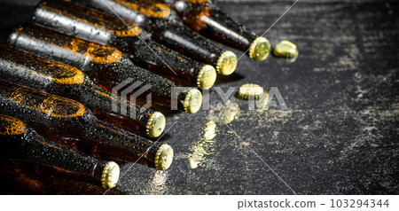 Fresh beer in closed bottles. Fresh beer in closed bottles. 103294344