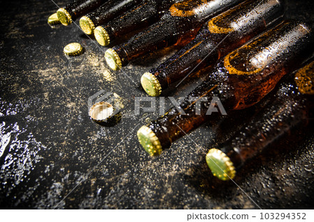 Fresh beer in closed bottles. 103294352
