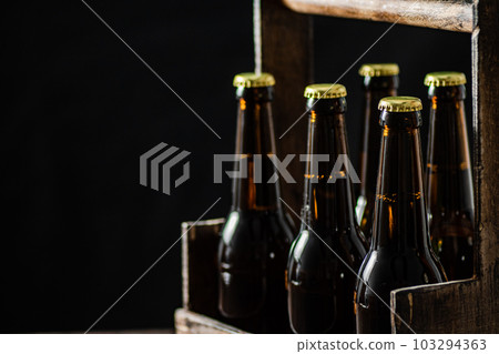 Beer bottles in an old box. 103294363