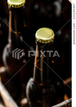 Beer bottles in an old box. Beer bottles in an old box. 103294367
