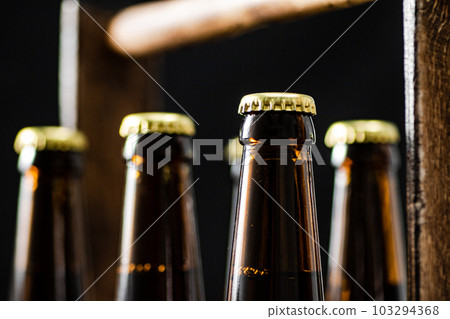 Beer bottles in an old box. Beer bottles in an old box. 103294368
