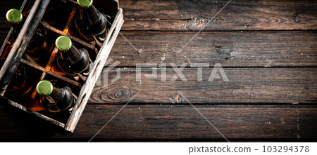 Beer bottles in an old box. 103294378