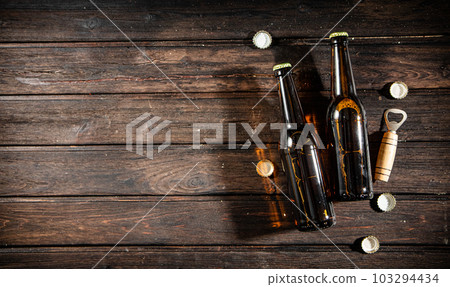 Bottles with beer and opener. Bottles with beer and opener. 103294434