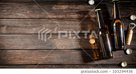 Bottles with beer and opener. Bottles with beer and opener. 103294436