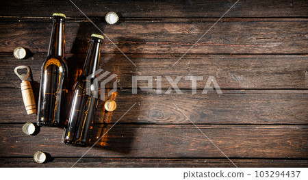 Bottles with beer and opener. Bottles with beer and opener. 103294437