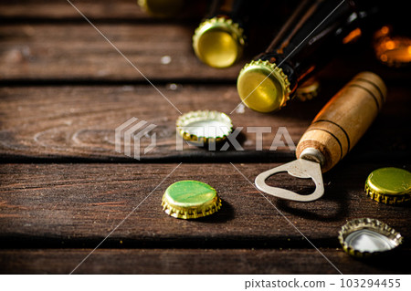 Bottles with beer and opener. Bottles with beer and opener. 103294455