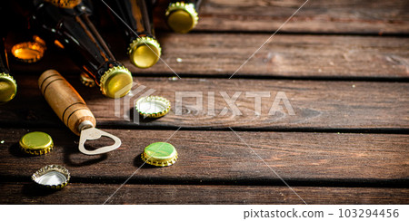 Bottles with beer and opener. Bottles with beer and opener. 103294456