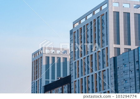 cityscape, urban background, group of facades of modern high-rise buildings against the sky cityscape, urban background, group of facades of modern high-rise buildings against the sky 103294774