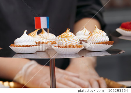 Mini tarts, cupcakes displayed at the French wine and food street festival in Prague Holesovice. 103295364