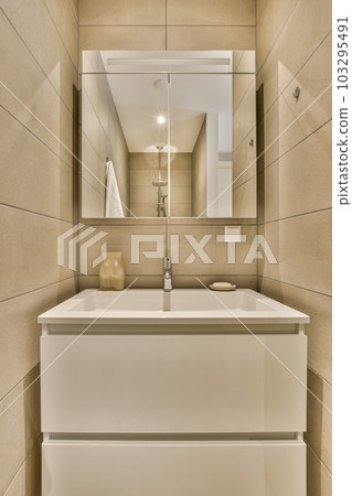 a bathroom with a sink and mirror on the wall next to it is an image of a toilet in the corner a bathroom with a sink and mirror on the wall next to it is an image of a toilet in the corner 103295491