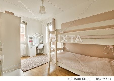 a small room with bunks and a desk in the corner between the bed to the other room is an open door a small room with bunks and a desk in the corner between the bed to the other room is an open door 103295524