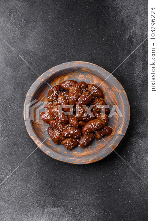 Chicken hearts fried in soy sauce with salt and spices in a plate 103296223