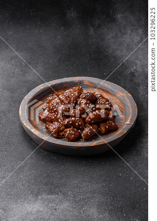 Chicken hearts fried in soy sauce with salt and spices in a plate 103296225
