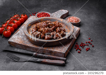 Chicken hearts fried in soy sauce with salt and spices in a plate Chicken hearts fried in soy sauce with salt and spices in a plate 103296270