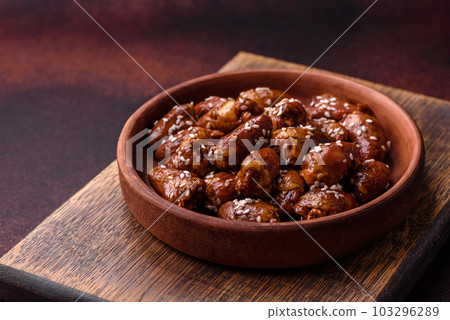 Chicken hearts fried in soy sauce with salt and spices in a plate Chicken hearts fried in soy sauce with salt and spices in a plate 103296289