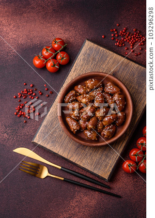 Chicken hearts fried in soy sauce with salt and spices in a plate 103296298