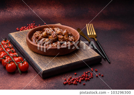 Chicken hearts fried in soy sauce with salt and spices in a plate Chicken hearts fried in soy sauce with salt and spices in a plate 103296300