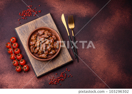 Chicken hearts fried in soy sauce with salt and spices in a plate 103296302