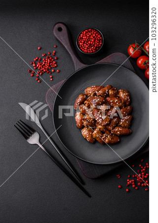 Chicken hearts fried in soy sauce with salt and spices in a plate 103296320