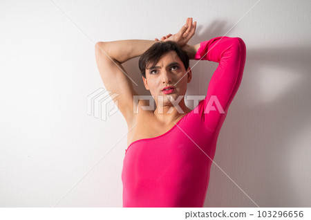 Homosexual in a pink female dress. A man in make-up. Homosexual in a pink female dress. A man in make-up. 103296656