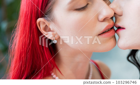 Close-up portrait of kissing Caucasian women. same sex love. Close-up portrait of kissing Caucasian women. same sex love. 103296746