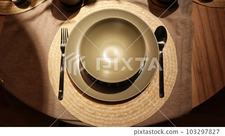 Dinning table set at home, tableware, glasses, spoon and fork. 103297827