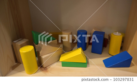 Hardwood wooden building block set for toddlers preschool age. Colored small wood blocks. Basic educational play toy. 103297831