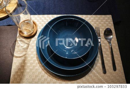 Dinning table set at home, tableware, glasses, spoon and fork. 103297833