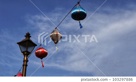 Colorful chinese lantern at hanging at the cable with blue sky background. 103297886