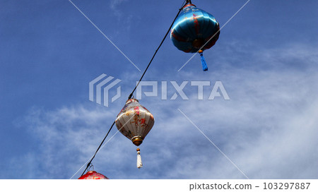 Colorful chinese lantern at hanging at the cable with blue sky background. 103297887