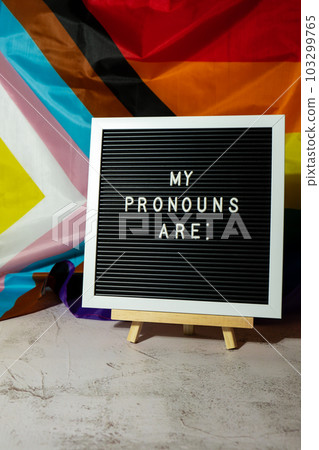 MY PRONOUNS ARE text Neo pronouns concept on Rainbow flag background gender pronouns. Non-binary people rights transgenders. Lgbtq community support assume my gender tolerance equal rights 103299765