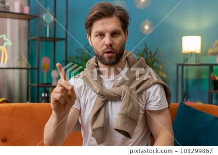 Displeased young man reacting to unpleasant awful idea, dismiss bad idea, wave hand, shake head No 103299867