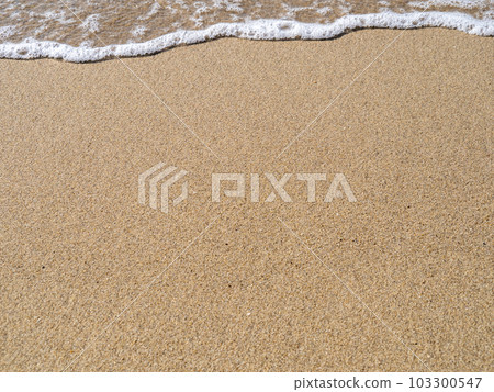background material. Waves on the sandy beach. 103300547
