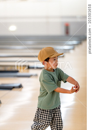 children playing in the bowling alley children playing in the bowling alley 103301658