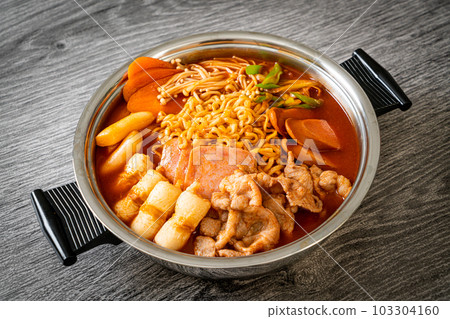 Budae Jjigae or Budaejjigae (Army stew or Army base stew). It is loaded with Kimchi, spam, sausages, ramen noodles and much more 103304160