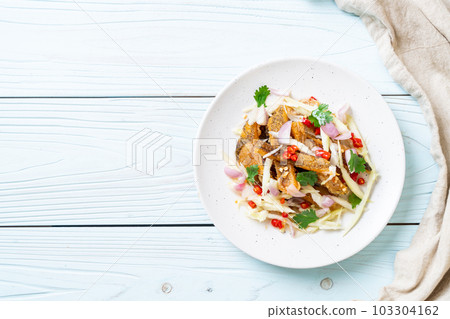 crispy gourami fish with spicy salad crispy gourami fish with spicy salad 103304162
