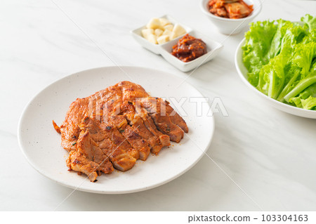 grilled pork marinated Kochujang sauce in Korean style with vegetable and kimchi 103304163