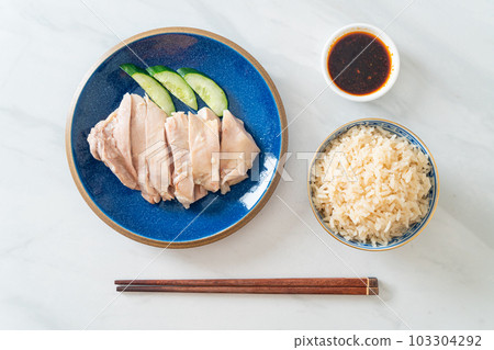 Hainanese chicken rice or rice steamed with chicken soup Hainanese chicken rice or rice steamed with chicken soup 103304292